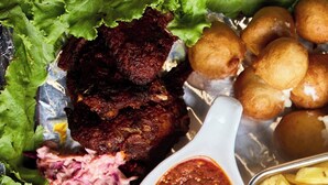 A variety of food items including fried fish, meat, coleslaw, and French fries. - De Glen Hotel And Suites (Owerri)