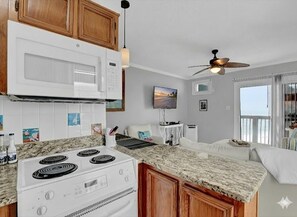 Fridge, microwave, oven, stovetop - Captain's Quarters | Oceanfront Condo (North Topsail Beach)