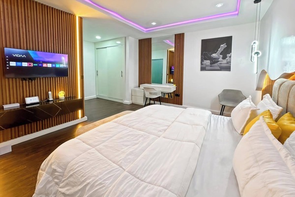 Deluxe Room, Balcony, City View | Desk, laptop workspace, blackout drapes, soundproofing