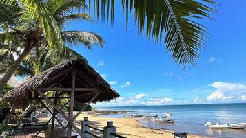 On the beach, sun-loungers, beach umbrellas, beach towels