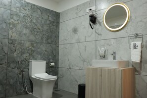 Shower, jetted tub, hair dryer, bidet