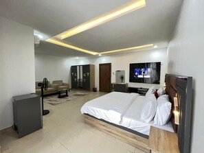 Family Room, Balcony, City View | Desk, laptop workspace, blackout drapes, soundproofing