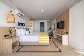 A modern hotel room with a large bed, bedside tables, a TV, and a bathroom visible through an open door. - BaÅŸka Resort Bodrum - All inclusive (Bodrum)