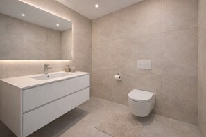 Shower, towels, soap, toilet paper