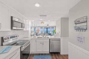 Fridge, microwave, oven, stovetop - Unit 403 | Gulf-Front 2BR with Balcony • Newly Remodeled & VIP Beach Service (Panama City Beach)
