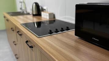 Fridge, microwave, stovetop, cookware/dishes/utensils