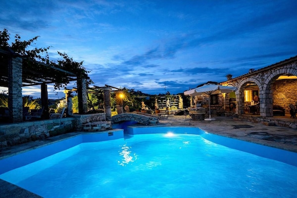 Beautifully lit swimming pool in the evening — perfect for a relaxing swim or unwinding outdoors after a day exploring the area.