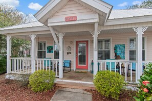 A white building with a porch, a red door, and a number 4447 sign. - ⛱️Walk to Beach | Steps from Neighborhood Pool | Best Nest☀️ (Destin)