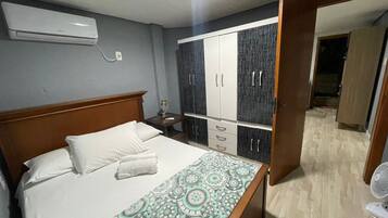 Apartamento básico | Wi-Fi de cortesia, roupa de cama