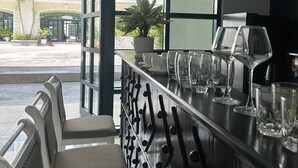 A bar area with seating and a view of the street. - MK Hotel Phu Quoc (Phu Quoc)
