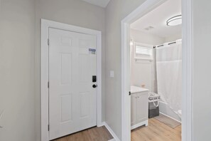 Shower, hair dryer, towels, shampoo