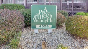 A sign for 'A Place at the Beach Windy Hill' with the address 4525. - North Myrtle Newly Remodeled Oceanfront View Suite (North Myrtle Beach)