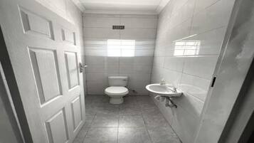 Shower, towels, soap, toilet paper