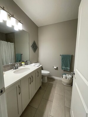 Hair dryer, towels, soap, toilet paper - Two Bedroom Basement Suite (Calgary)