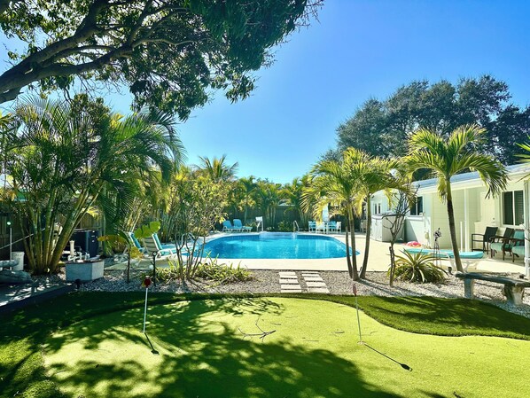 Outdoor pool, a heated pool - Blastoff Beach House w HUGE Pool, Putting Green...And More!! 4 Blocks to Beach. (Cape Canaveral)