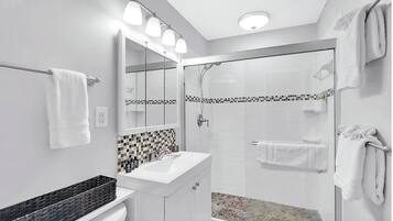 Shower, hair dryer, towels, soap