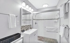 Shower, hair dryer, towels, soap