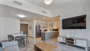 A modern apartment with a dining area, kitchen, and living room. - Elegant 2Bed | Walk to Burj Khalifa & Dubai Mall (Downtown, Dubai)
