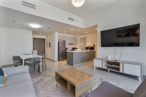A modern apartment with a dining area, kitchen, and living room. - Elegant 2Bed | Walk to Burj Khalifa & Dubai Mall (Downtown, Dubai)