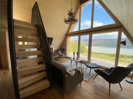 Superior Chalet, Lake View | Living area | Fireplace. Hengifosslodge Tiny Houses