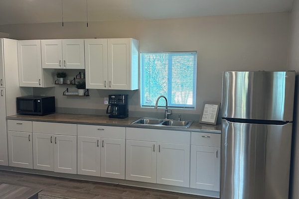 Fridge, microwave, stovetop, coffee/tea maker