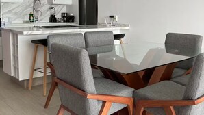 A modern kitchen with white cabinets, a stainless steel range hood, and a built-in microwave. - 508 New apartment, in Real Real View area 2 bedrooms (Zapopan)