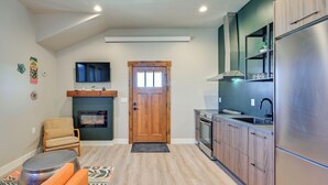 A modern kitchen with wooden cabinets, a stainless steel refrigerator, and a built-in oven. - 1 Mi to Main Street: Extended Stay in Buena Vista! (Buena Vista)