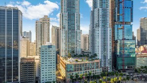A high-rise urban area with modern buildings, including a prominent glass skyscraper and several high-rise residential towers. - The Vizcayne Vibe- Sauna, Pool and Sundeck (Miami)
