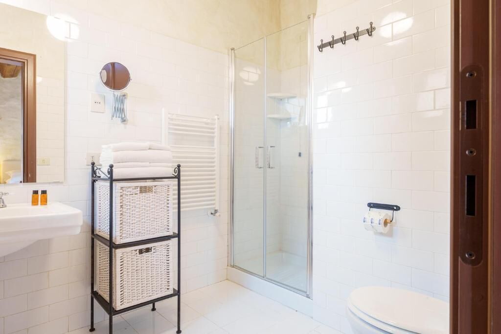 Shower, towels, soap, toilet paper