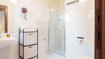 Shower, towels, soap, toilet paper