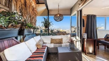 Premium Apartment, Non Smoking, City View | Living area | 50-inch LED TV with digital channels