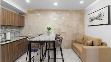 Deluxe Apartment, 1 Double Bed with Sofa bed, Non Smoking, City View | Living area | 50-inch LED TV with digital channels