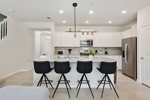 High chair, dining tables - Luxury 5BR Home w/ Private Pool Near Disney (Davenport)