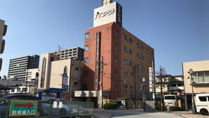 A multi-story building with a prominent sign on the top. - Hotel Stay Inn San Annex (Yamagata)