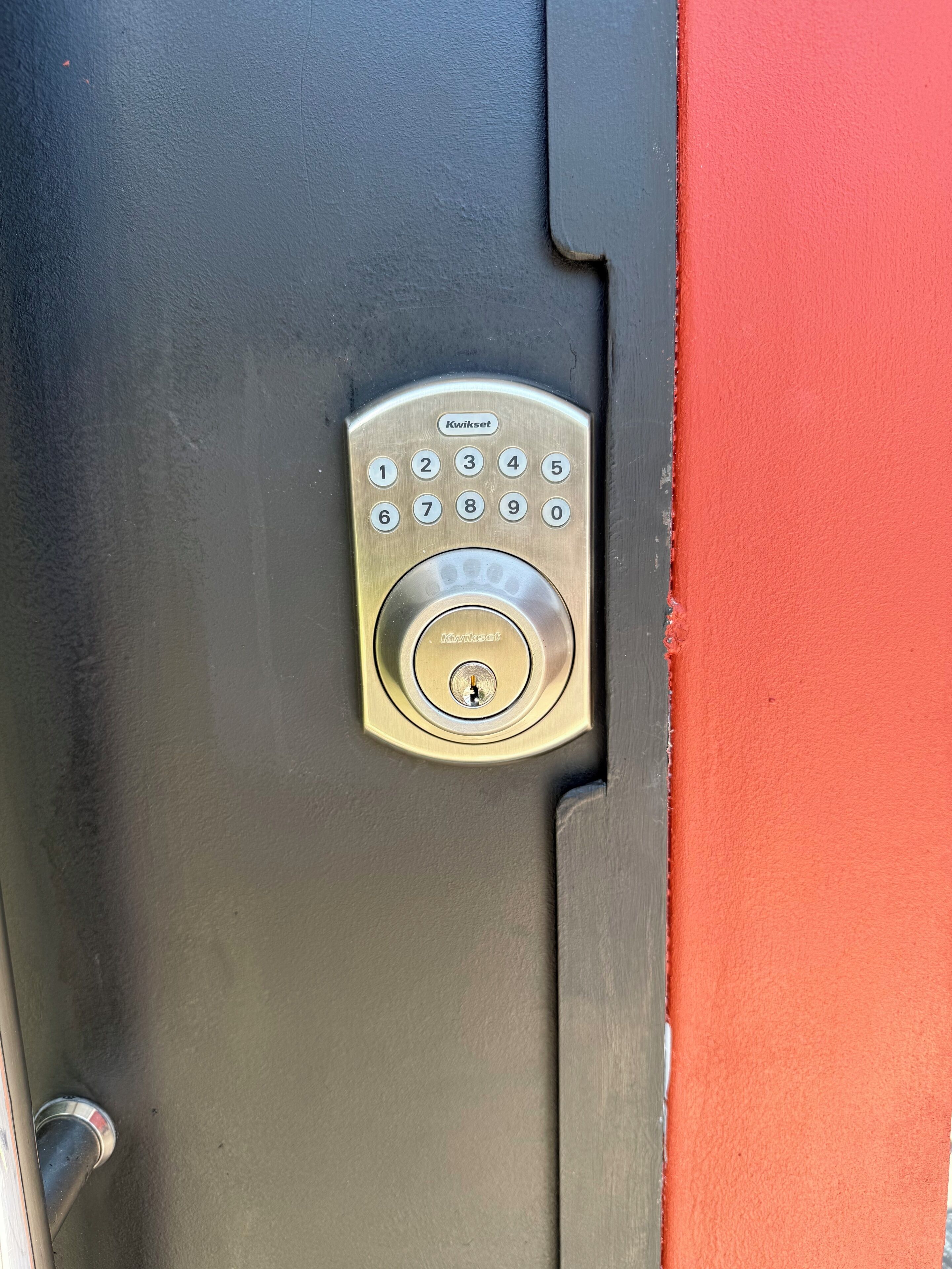 A door with a numeric keypad lock.