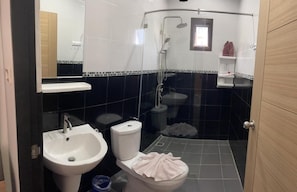 A bathroom with a toilet, bidet, sink, and shower. - Lotus Bleu Resort & Restaurant (Rawai)
