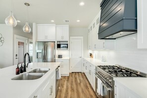Fridge, microwave, oven, stovetop - NEW Bayfront | Hot Tub | Beach Nearby | Kayaks | Pets OK | Fully Fenced | Huge Decks | Patio (Jamaica Beach)