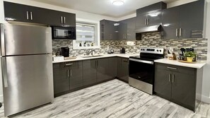 Fridge, microwave, oven, stovetop - Sparsh Villas - Lux+ Modern 2BR Suite w/Kitchen (Delta)