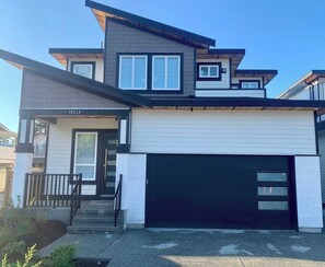 Exterior - Newly built, Luxurious 2-bedroom private basement suite with its own entrance. Enjoy 1GB high-speed Wi-Fi, parking for 2 cars or 1 RV, a full kitchen, and fenced garden minutes from city life on a quiet street. (Delta)