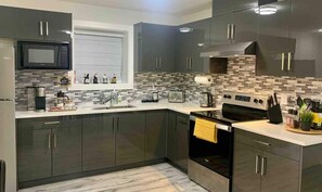 Fridge, microwave, oven, stovetop - Newly built, Luxurious 2-bedroom private basement suite with its own entrance. Enjoy 1GB high-speed Wi-Fi, parking for 2 cars or 1 RV, a full kitchen, and fenced garden minutes from city life on a quiet street. (Delta)