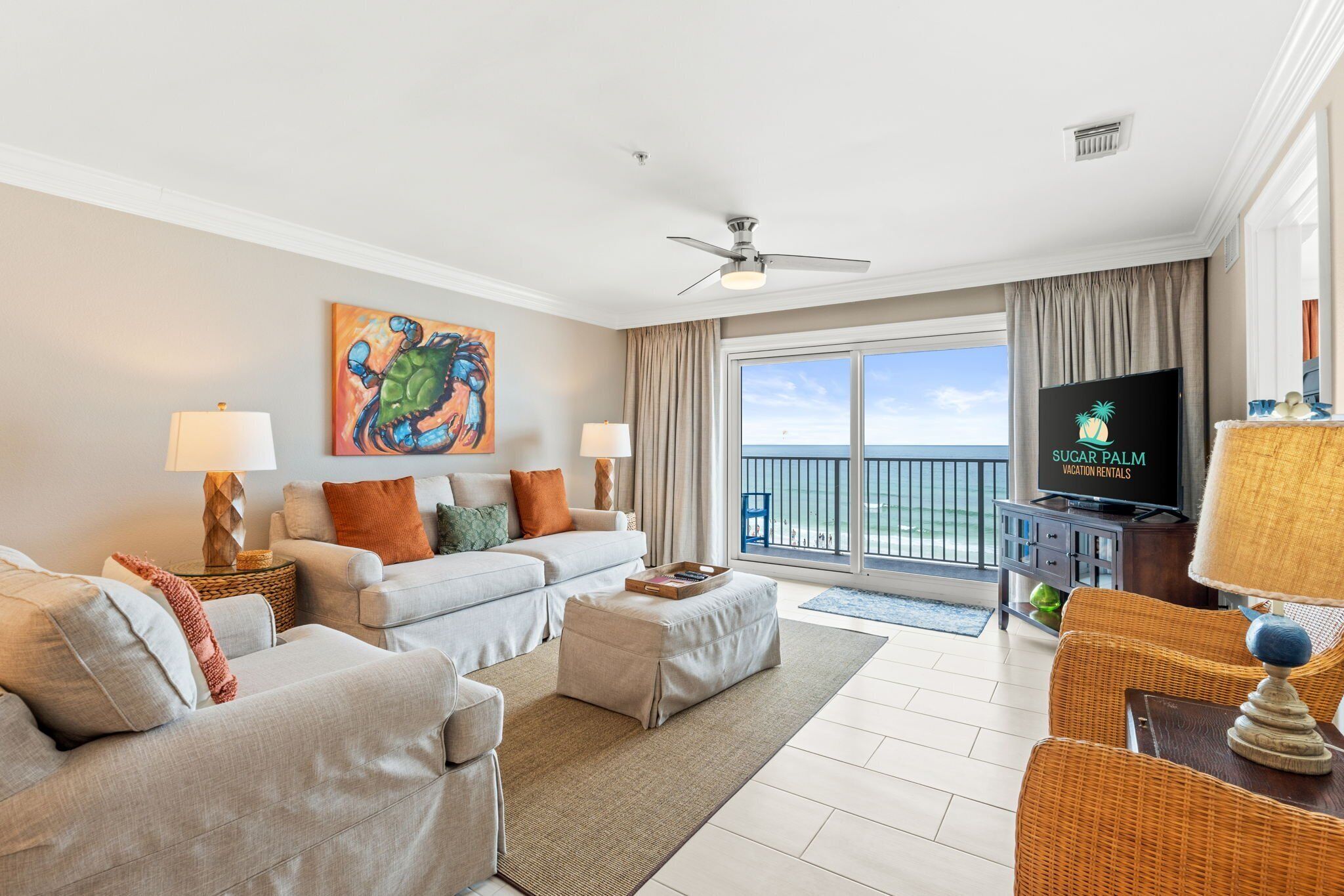 Open living area features a large TV with plenty of seating.
