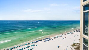 A beach view with a clear sky, a sandy beach, and numerous umbrellas. - Must See ! Beach Front~ 2 King Mstrs +2 Q Bdrm ~ Fantastic Views! (Destin)