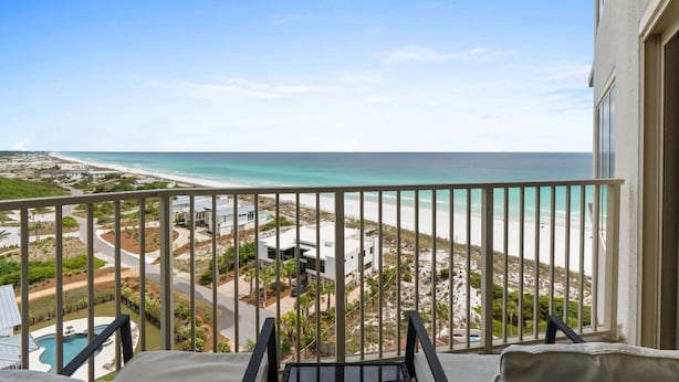 A balcony with a view of a beach and ocean. - New! Beach Manor 1005 Gorgeous Remodeled Condo w/ Gulf Views & Resort Amenities (Miramar Beach)