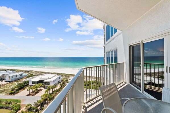 A balcony with a view of the beach and ocean. - New! Remodeled Gulf Front Condo~Pools~Sauna~Hot Tub~Beach Manor 1004 (Miramar Beach)