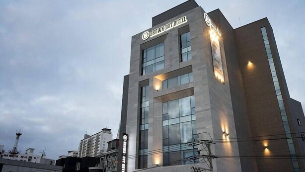 A modern hotel building with a prominent sign reading "BROWN DOT HOTEL". - Guseo Station Brown Dot (Busan)