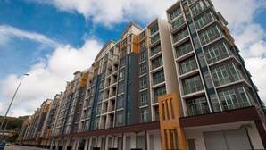 A multi-story residential building with balconies, large windows, and a modern architectural design. - Dreamscape Apartment at Golden Hill (Tanah Rata)