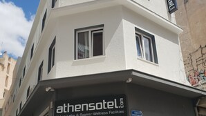 A building with a sign for 'athensotel' indicating it offers urban lofts and wellness facilities. - Athensotel.com (Athens)
