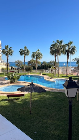 Outdoor pool. First line, beach, swimming pool and sunrise