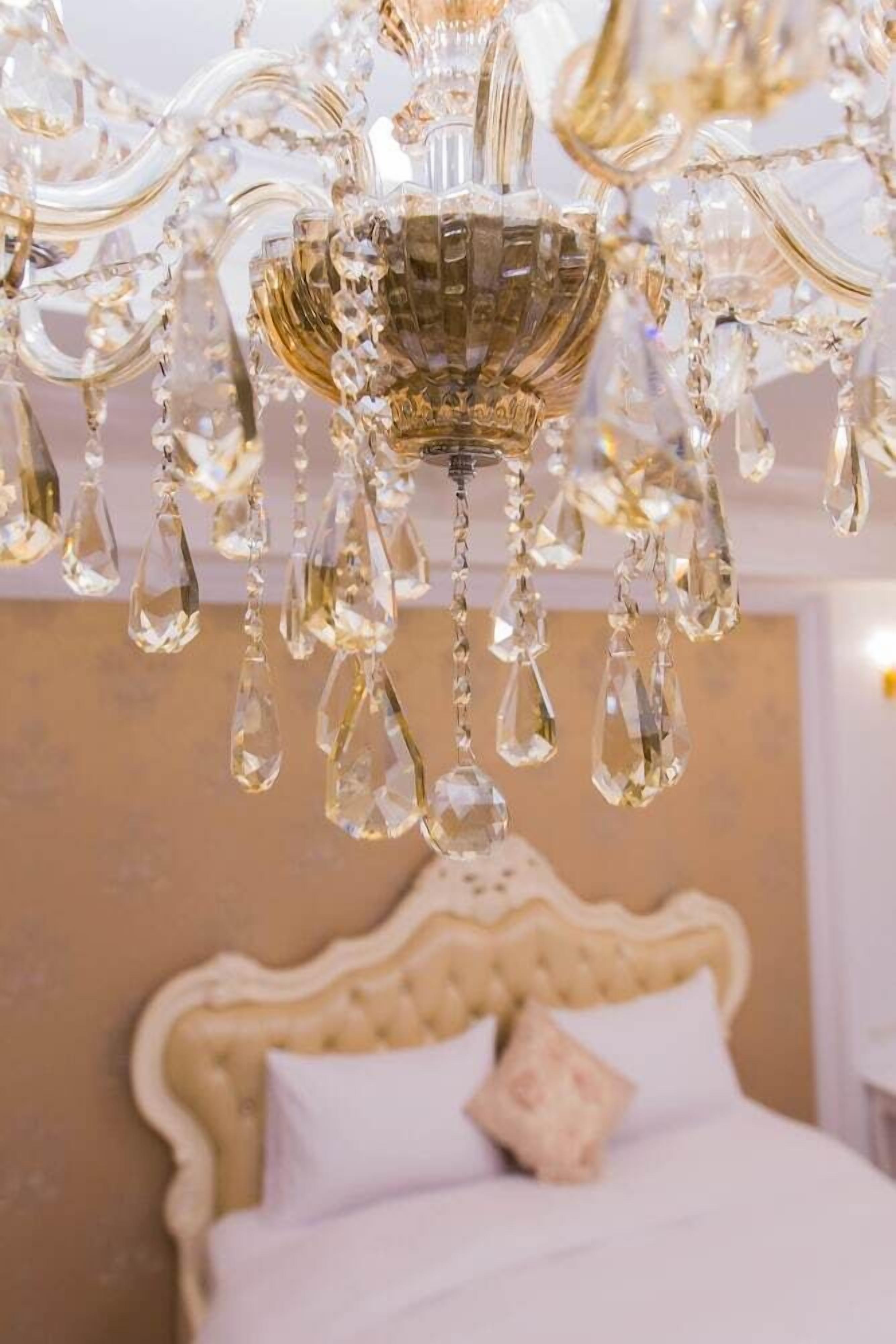 A chandelier with multiple crystal elements hanging from a central structure.