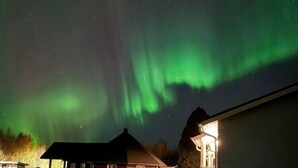 A house with a garage and a driveway. - Arctic Resort Delight (Rovaniemi)
